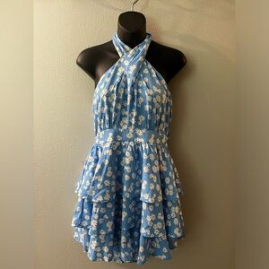 NWT halter cross top romper with tiered ruffle skirt over hidden shorts. Size L.